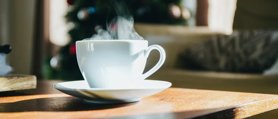 white cup on table